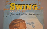 Äldre reklamskylt i papp för Swing.