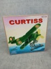 Flygplan. "Curtiss", Plåt, Kina, Samtida. Original låda.
