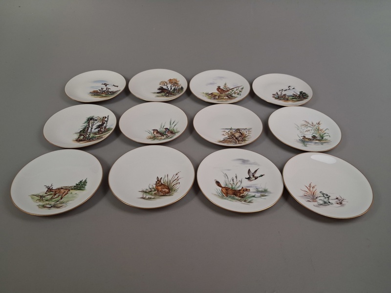12 Handmålade tallrikar, signerad J.Brødbøk.