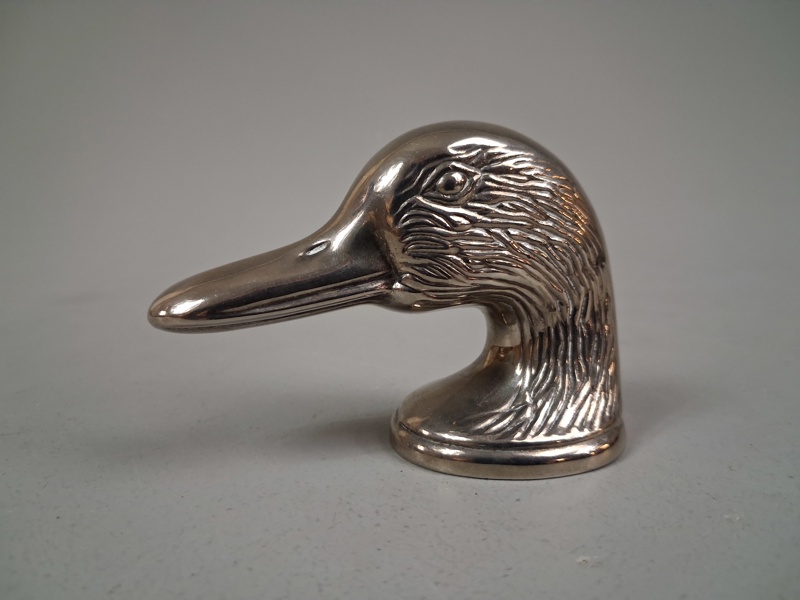 Kapsylöppnare. "Ducky", Vitmetall.