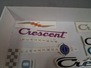 Klistermärke. Mestadels Crescent.