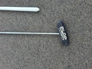 Säckakärra, parasoll & golfklubba.