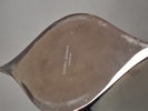Helle Damkjae. Vas. "Indulgence" för Georg Jensen. Vitmetall.
