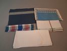 Diverse textil. Bl.a dukar, förkläde m.m.