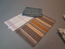 Diverse textil. Bl.a dukar, förkläde m.m.
