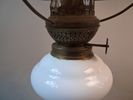 Fotogenlampa. Eventuellt lagad. Sned hållare.