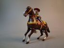 Plårleksak. "Cowboy med häst", Litograferad plåt, Haji, Japan.