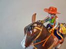 Plårleksak. "Cowboy med häst", Litograferad plåt, Haji, Japan.