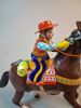 Plårleksak. "Cowboy med häst", Litograferad plåt, Haji, Japan.